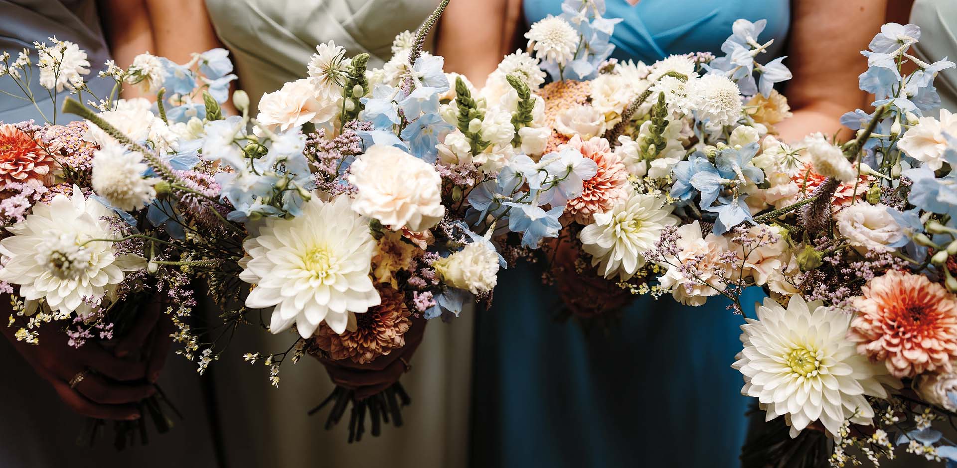 Elegant white bridal bouquet of roses designed by Artem Florum for a wedding in Devon.