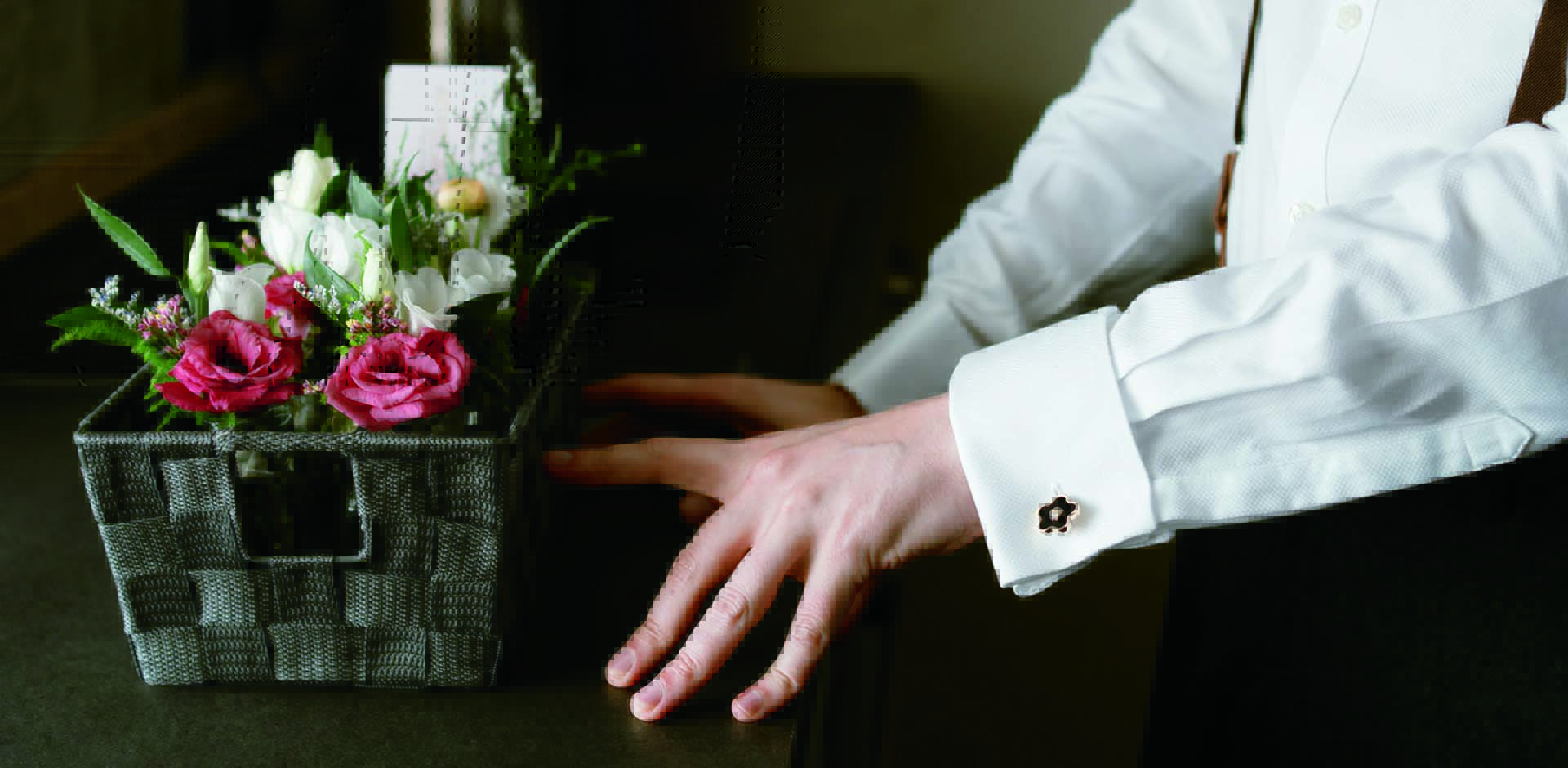 Elegant white bridal bouquet of roses designed by Artem Florum for a wedding in Devon.
