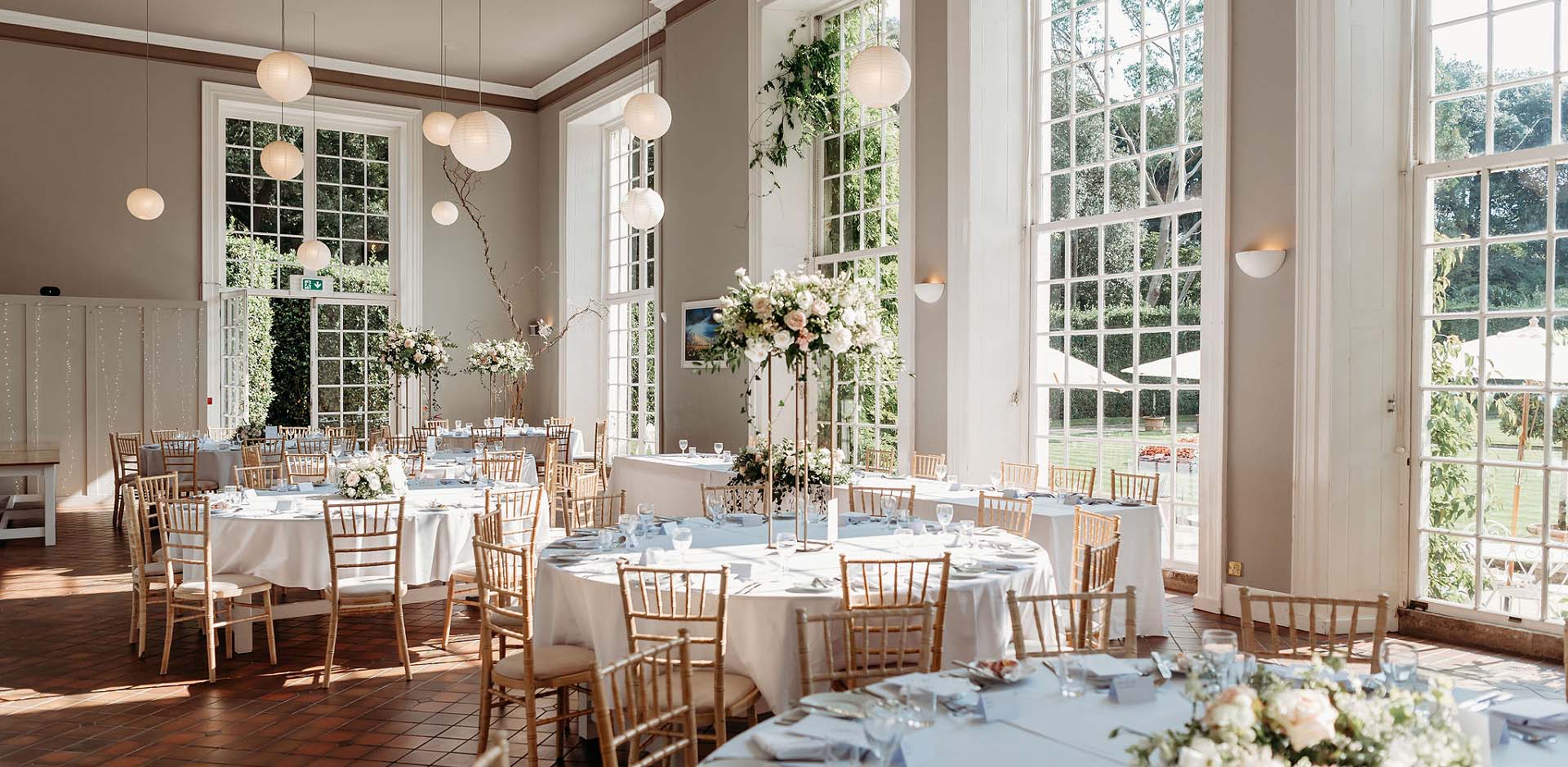 Elegant white bridal bouquet of roses designed by Artem Florum for a wedding in Devon.